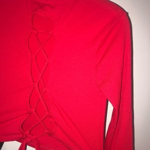 Long sleeve red cropped turtle neck. Open back